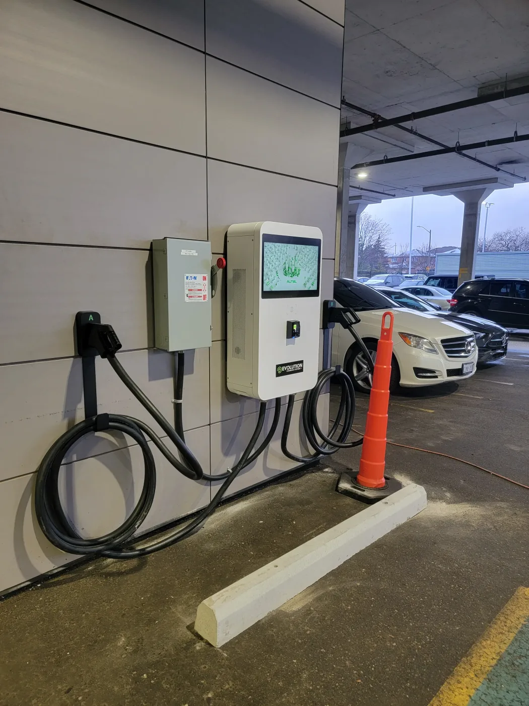 Movable charger in dealership service bay